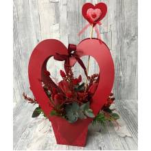 Arrangement with fresh red flowers in tall box heart  shape